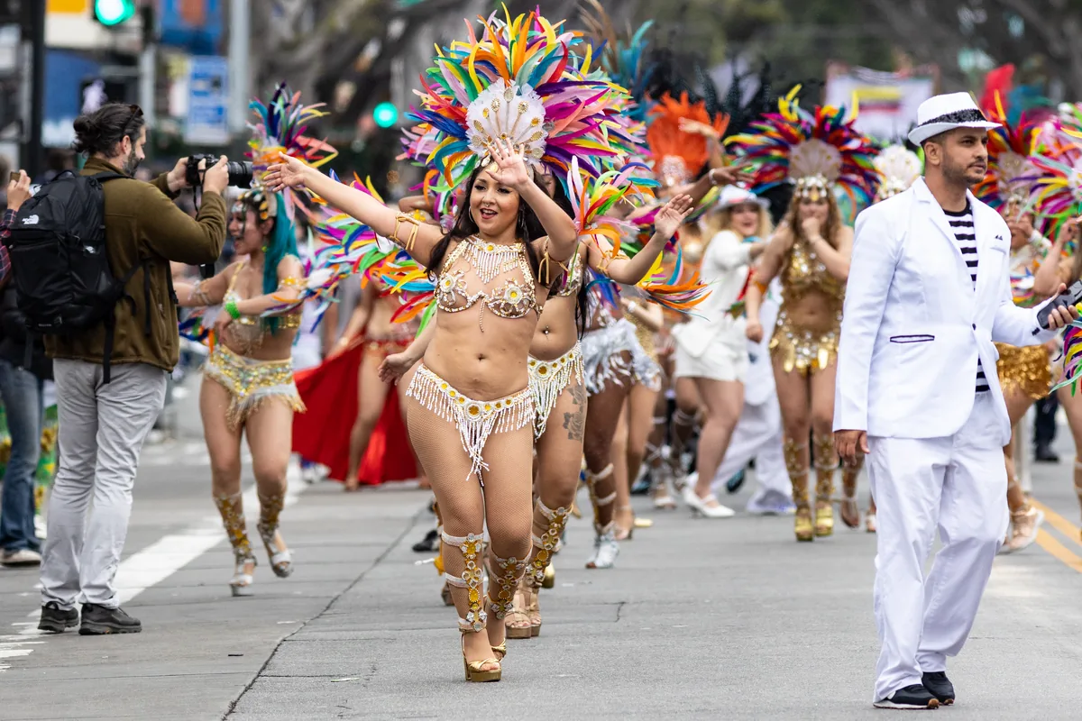 A samba dancer in feathered carnival costume